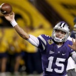  Kansas State's Jake Waters throws a pass as he warms up before the Buffalo Wild Wings Bowl NCAA college football game against Michigan, Saturday, Dec. 28, 2013, in Tempe, Ariz. (AP Photo/Ross D. Franklin)