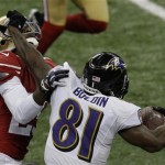 Baltimore Ravens wide receiver Anquan Boldin (81) fends off San Francisco 49ers defensive back Chris Culliver (29) during the second half of the NFL Super Bowl XLVII football game, Sunday, Feb. 3, 2013, in New Orleans. (AP Photo/Gerald Herbert)