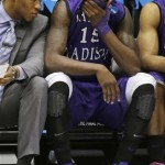 James Madison guard Andre Nation (15) sits on the bench at the end of their 83-62 loss to Indiana in a second-round game at the NCAA college basketball tournament on Friday, March 22, 2013, in Dayton, Ohio. Nation led James Madison with 24 points. (AP Photo/Al Behrman)