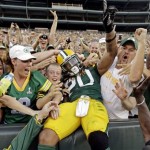  Green Bay Packers running back Alex Green celebrates with fans after rushing for a touchdown during the first half of an NFL preseason football game against the Kansas City Chiefs Thursday, Aug. 30, 2012, in Green Bay, Wis. (AP Photo/Morry Gash)