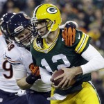 Green Bay Packers quarterback Aaron Rodgers is sacked by Chicago Bears' Shea McClellin during the first half of an NFL football game Monday, Nov. 4, 2013, in Green Bay, Wis. (AP Photo/Morry Gash)
