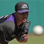 Colorado Rockies starting pitcher Jhoulys Chacin throws before the first inning of an exhibition spring training baseball game against the Chicago Cubs, Tuesday, Feb. 26, 2013, in Phoenix. (AP Photo/Morry Gash)