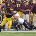 Arizona State running back Cameron Marshall, left, sheds the tackle attempt of Utah linebacker Boo Anderson, right, in the first quarter of an NCAA college football game, Saturday, Sept. 22, 2012, in Tempe, Ariz. (AP Photo/Paul Connors)
