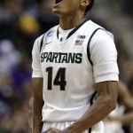 Michigan State guard Gary Harris reacts to hitting a 3-pointer against Memphis in the first half of their third-round game of the NCAA college basketball tournament in Auburn Hills, Mich., Saturday March 23, 2013. (AP Photo/Paul Sancya)
