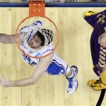 Duke's Ryan Kelly, left, goes up for a shot as Albany's John Puk defends during the first half of a second-round game of the NCAA college basketball tournament, Friday, March 22, 2013, in Philadelphia. (AP Photo/Matt Slocum)