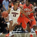 Arizona's Nick Johnson (13) dribbles around the defense of UTEP's Jacques Streeter (11) during the second half of an NCAA college basketball game at McKale Center in Tucson, Ariz., Thursday, Nov.15, 2012. Arizona 72 - 51. (AP Photo/John Miller)