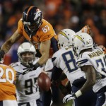 Denver Broncos wide receiver Eric Decker (87) leaps for an onside kick by the San Diego Chargers in the fourth quarter of an NFL AFC division playoff football game, Sunday, Jan. 12, 2014, in Denver. San Diego recovered the kick. (AP Photo/Joe Mahoney)