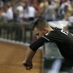 Miami Marlins starting pitcher Jose Fernandez is the last player in the team dugout after the ninth inning of a baseball game against the Arizona Diamondbacks, Wednesday, June 19, 2013, in Phoenix. The Diamondbacks defeated the Marlins 3-1. (AP Photo/Ross D. Franklin)