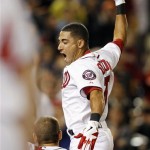 Washington Nationals' Ian Desmond celebrates with teammates after hitting a game-winning, two-run home run during the ninth inning of a baseball game against the Arizona Diamondbacks, Wednesday, May 2, 2012, in Washington. Bryce Harper scored on the play, and the Nationals won 5-4. (AP Photo/Haraz N. Ghanbari)