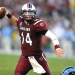South Carolina quarterback Connor Shaw (14) scrambles out of the pocket during the first half of an NCAA college football game against North Carolina, Thursday, Aug. 29, 2013, in Columbia, S.C. (AP Photo/Stephen Morton)