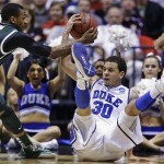 Duke guard Seth Curry (30) and Michigan State guard Keith Appling (11) fight for a loose ball during the second half of a regional semifinal in the NCAA college basketball tournament, Friday, March 29, 2013, in Indianapolis. (AP Photo/Darron Cummings)