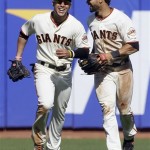 San Francisco Giants right fielder Gregor Blanco, left, and center fielder Angel Pagan celebrate after the final out of the ninth inning of a baseball game against the Arizona Diamondbacks in San Francisco, Monday, May 28, 2012. The Giants won 4-2. (AP Photo/Jeff Chiu)