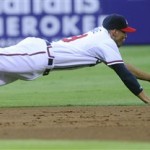 Atlanta Braves shortstop Andrelton Simmons can't get his glove on a ball hit by Arizona Diamondbacks' Miguel Montero during the second inning of a baseball game, Tuesday, June 26, 2012, in Atlanta. (AP Photo/John Amis)