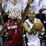 San Antonio Spurs' Tony Parker (9) shoots against Miami Heat's Chris Bosh (1) during the first half of Game 3 in their NBA Finals basketball series, Tuesday, June 11, 2013, in San Antonio. (AP Photo/David J. Phillip)