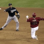 Florida Marlins' Emilio Bonifacio forces out Arizona Diamondbacks' Xavier Nady (22) on a double play while throwing out Ryan Roberts during the eight inning of a baseball game, Wednesday, June 1, 2011, in Phoenix. (AP Photo/Matt York)