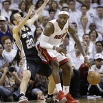 The Miami Heat's LeBron James (6) moves the ball against San Antonio Spurs' Manu Ginobili (20) during the first half in Game 7 of the NBA basketball championships, Thursday, June 20, 2013, in Miami. (AP Photo/Lynne Sladky)