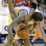 Phoenix Suns' Channing Frye, top, and Golden State Warriors' Monta Ellis fight for the ball during the second half of an NBA basketball game Thursday, Dec. 2, 2010, in Oakland, Calif. (AP Photo/Ben Margot)