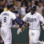 Tampa Bay Rays' Yunel Escobar, right, celebrates with on-deck batter Desmond Jennings after hitting a fourth-inning home run off Arizona Diamondbacks starting pitcher Ian Kennedy during an interleague baseball game Tuesday, July 30, 2013, in St. Petersburg, Fla. (AP Photo/Chris O'Meara)