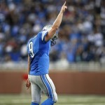 Detroit Lions quarterback Matthew Stafford (9) celebrates scoring on a 1-yard touchdown run against the Dallas Cowboys in the fourth quarter of an NFL football game in Detroit, Sunday, Oct. 27, 2013. (AP Photo/Rick Osentoski)