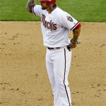 Arizona Diamondbacks' Ryan Roberts waves to his dugout after hitting a two-run double during the sixth inning of an opening day baseball game against the San Francisco Giants, Friday, April 6, 2012, in Phoenix. (AP Photo/Matt York)