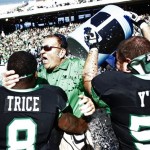 North Texas defensive back Marcus Trice (8) and offensive lineman Mason Y'Barbo (57) douse head coach Dan McCarney following their 36-14 win over UNLV in the Heart of Dallas NCAA college football game, Wednesday, Jan. 1, 2014, in Dallas. (AP Photo/Mike Stone)
