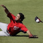 Washington Nationals' Anthony Rendon chases down a two-RBI single by Philadelphia Phillies' Laynce Nix during the fifth inning of a spring training exhibition baseball game, Wednesday, March 6, 2013, in Clearwater, Fla. Philadelphia won 6-3. (AP Photo/Matt Slocum)