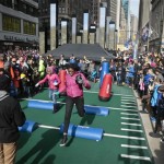 Football fans run an obstacle course on Super Bowl Boulevard, 13 blocks of entertainment activity stretching from 47th Street to 34th Street, Saturday Feb. 1, 2014, in New York. (AP Photo/Bebeto Matthews)