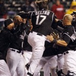 Colorado Rockies' Todd Helton, center, jumps into arms of his 
teammates as Helton crosses home plate after hiting a two-run, 
walkoff home run against the Arizona Diamondbacks in the ninth 
inning to give the Rockies' 8-7 victory in a baseball game in Denver on 
Saturday, April 14, 2012. (AP Photo/David Zalubowski)