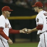Arizona Diamondbacks manager Kirk Gibson, left, takes the baseball from Wade Miley as he leaves the game during the sixth inning of a baseball game against the Atlanta Braves, on Monday, May 13, 2013, in Phoenix. (AP Photo/Ross D. Franklin)