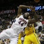 Atlanta Hawks power forward Ivan Johnson (44) loses the ball as Indiana Pacers power forward David West (21) defends during the second half of an NBA first-round playoff basketball game in Atlanta, Friday, May 3, 2013. (AP Photo/John Bazemore)
