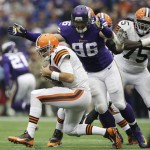 Minnesota Vikings defensive end Brian Robison (96) sacks Cleveland Browns quarterback Brian Hoyer, left, during the second half of an NFL football game Sunday, Sept. 22, 2013, in Minneapolis. (AP Photo/Jim Mone)