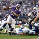  Minnesota Vikings' Adrian Peterson (28) breaks away from tackles as he heads for the end zone on a touchdown run during the second half of an NFL football game against the Dallas Cowboys, Sunday, Nov. 3, 2013, in Arlington, Texas. (AP Photo/Tim Sharp)