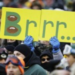  A fan holds up a sign during the first half of an NFL wild-card playoff football game between the Green Bay Packers and the San Francisco 49ers, Sunday, Jan. 5, 2014, in Green Bay, Wis. (AP Photo/Jeffrey Phelps)