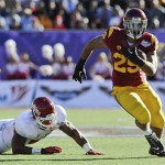  Southern California running back Ty Isaac (29) rushes the ball against Fresno State during the second quarter of the Royal Purple Bowl NCAA college football game, Saturday, Dec. 21, 2013, in Las Vegas. (AP Photo/David Cleveland)