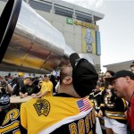 Joe Pagnotta, of Somerville, Mass., kisses a replica of the Stanley Cup outside TD Garden before Game 4 of the NHL hockey Stanley Cup Finals between the Boston Bruins and the Chicago Blackhawks in Boston, Wednesday, June 19, 2013. (AP Photo/Charles Krupa)