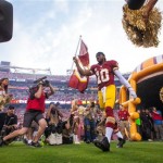  Washington Redskins quarterback, Roger Griffin III (10) comes onto the field from the tunnel to a cheering crowd before their NFL football game against the Philadelphia Eagles Monday, Sept. 9, 2013, in Landover, Md. (AP Photo/The Wilmington News-Journal, Suchat Pederson) NO SALES.