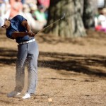 Tiger Woods hits out of the rough off the 15th fairway during the third round of the Masters golf tournament Saturday, April 13, 2013, in Augusta, Ga. (AP Photo/Matt Slocum)
