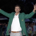 Adam Scott, of Australia, celebrates with his green jacket after winning the Masters golf tournament Sunday, April 14, 2013, in Augusta, Ga. (AP Photo/Matt Slocum)
