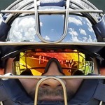 The sky and field are reflected in the glasses and helmet of Detroit Tigers catcher Alex Avila during a baseball spring training workout Tuesday, Feb. 12, 2013, in Lakeland, Fla. (AP Photo/Charlie Neibergall)