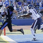 Buffalo wide receiver Alex Neutz (19) scores on a touchdown after a reception in front of Connecticut cornerback Byron Jones (16) during the first half of an NCAA college football game on Saturday, Sept. 28, 2013, in Buffalo, N.Y. (AP Photo/Mike Groll)
