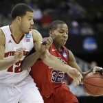Mississippi guard Jarvis Summers (32) is fouled by Wisconsin guard Traevon Jackson (12) during the first half of a second-round game in the NCAA college basketball tournament at the Sprint Center in Kansas City, Mo., Friday, March 22, 2013. (AP Photo/Orlin Wagner)