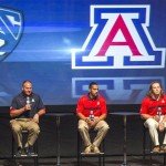 Arizona head coach Rich Rodriguez, left, 
quarterback Matt Scott, center, and linebacker 
Jake Fisher take questions at the Pac-12 
football media day in Los Angeles Tuesday, July 
24, 2012. (AP Photo/Damian Dovarganes)