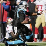  San Francisco 49ers strong safety Donte Whitner (31) tackles Carolina Panthers quarterback Cam Newton (1) during the first half of a divisional playoff NFL football game, Sunday, Jan. 12, 2014, in Charlotte, N.C. (AP Photo/Chuck Burton)