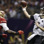 Baltimore Ravens quarterback Joe Flacco (5) throws a pass over San Francisco 49ers linebacker Aldon Smith (99) during the first half of the NFL Super Bowl XLVII football game, Sunday, Feb. 3, 2013, in New Orleans. (AP Photo/Evan Vucci)
