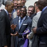 Retired Baltimore Ravens football linebacker Ray Lewis, center, laughs as President Barack Obama is presented with a personalized team jersey during a ceremony on the South Lawn of the White House in Washington, Wednesday, June 5, 2013, where the president honored the Super Bowl XLVII champs. The Ravens defeated the San Francisco 49ers in Super Bowl XLVII. (AP Photo/Evan Vucci)