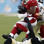 Arizona Cardinals running back LaRod Stephens-Howling is tackled by 
New Orleans Saints defensive back Malcolm Jenkins (27), rear, and 
New Orleans Saints defensive back Roman Harper (41), bottom, during 
the first quarter of the Hall of Fame exhibition football game against 
the Arizona Cardinals, Sunday, Aug. 5, 2012 in Canton, Ohio. (AP 
Photo/Scott Galvin)
