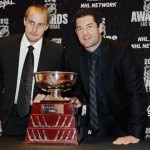 St. Louis Blues goalies, Jaroslav Halak, left, and Brian Elliott pose with the William Jennings trophy after winning the award for fewest goals allowed by goaltenders playing a minimum of 25 games during the NHL Awards, Wednesday, June 20, 2012, in Las Vegas. (AP Photo/Julie Jacobson)