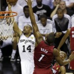San Antonio Spurs' Gary Neal (14) shoots against Miami Heat's Chris Bosh (1) during the first half at Game 3 of the NBA Finals basketball series, Tuesday, June 11, 2013, in San Antonio. (AP Photo/David J. Phillip)