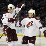  Phoenix Coyotes defenseman Connor Murphy (5) and left winger Tim Kennedy (34) celebrate a goal by Martin Hanzal during the second period of an NHL hockey game against the Buffalo Sabres in Buffalo, N.Y., Monday, Dec. 23, 2013. (AP Photo/Gary Wiepert)