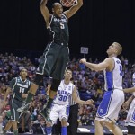 Michigan State forward Adreian Payne (5) dunks in front of Duke's Mason Plumlee (5) during the second half of a regional semifinal against Duke in the NCAA college basketball tournament, Friday, March 29, 2013, in Indianapolis. (AP Photo/Darron Cummings)